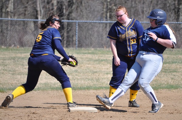 Makenzie Moner prepares a tag on a Lions runner after a throw in from the outfield.