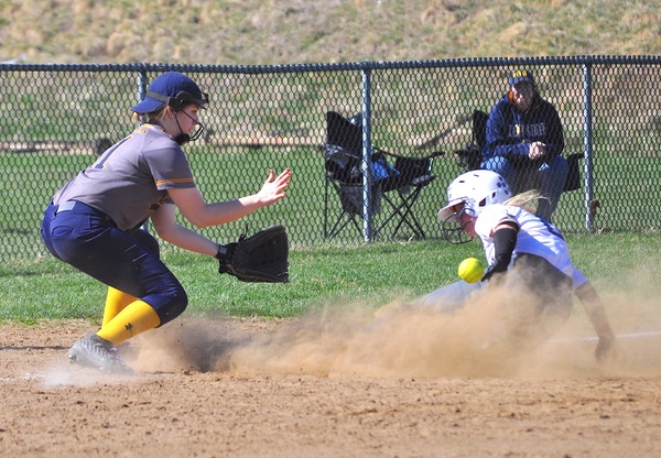 Golden Eagles Micaiah Stemple readies to field a relay to third base and tag out a PSU DuBois runner on her birthday.