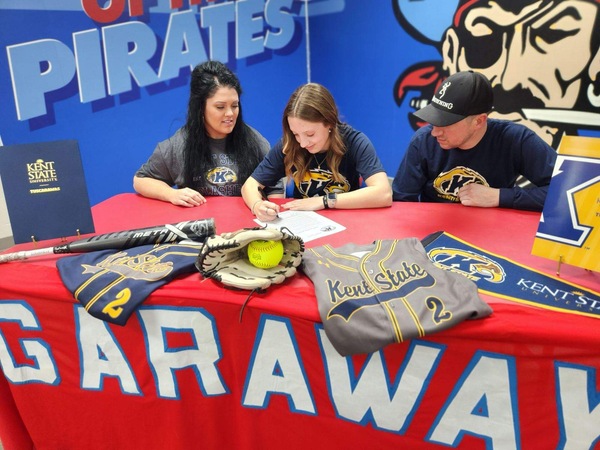 Grace Yoder signs her letter of intent witnessed by her mother Reandra and father Robert. (Photo Courtesy of Garaway Athletic Department)